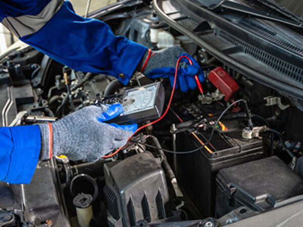 Mechanic inspecting a vehicle